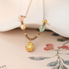 Harmony's Golden Apple Necklace | Gems | Pearl