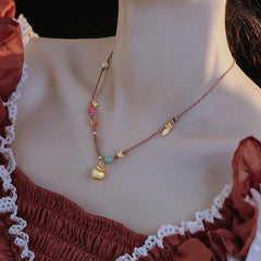 Harmony's Golden Apple Necklace | Gems | Pearl
