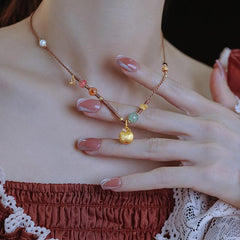 Harmony's Golden Apple Necklace | Gems | Pearl